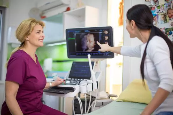 Woman talking to Dr. about her 4D Ultrasound image