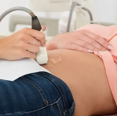 Nurse performing ultrasound on customer